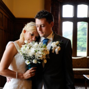 bride and groom up close in drawing room